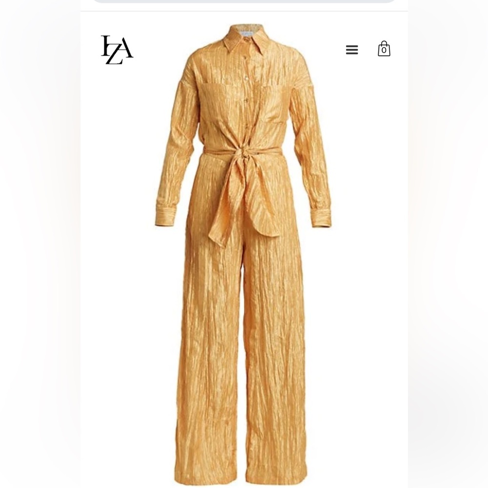 Shiny crinkled taffeta jumpsuit with a self-tie. Color is Sunset orange.